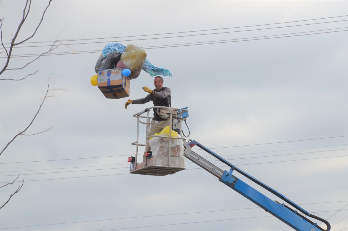 Packaged pumpkin being dropped from crane