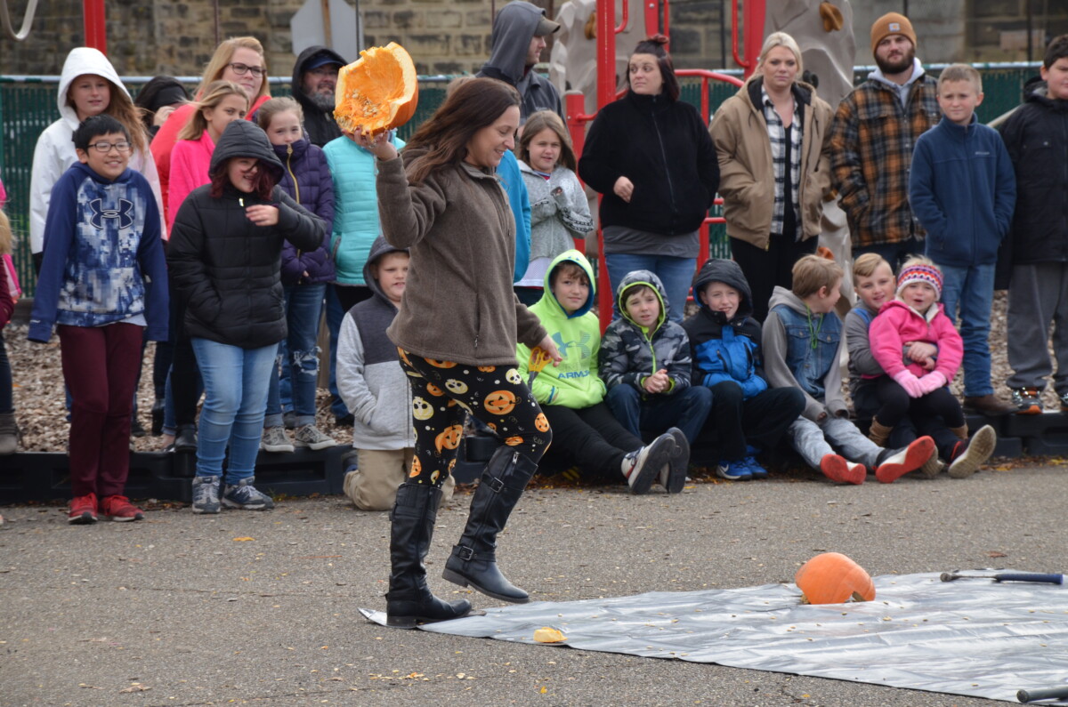 Student smashing pumpkin